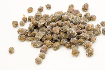 Salted capers of Pantelleria on a white background