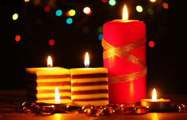 Wonderful candles on wooden table on bright background