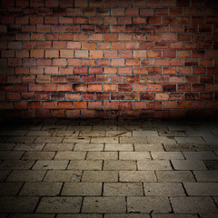 Grunge brick wall with sidewalk floor interior background
