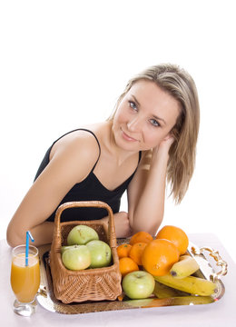Young smiling woman with fruits