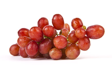 Red grapes on white background.