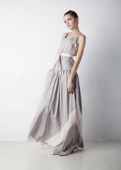 Fototapeta premium Romantic young woman beauty wearing white fashion dress