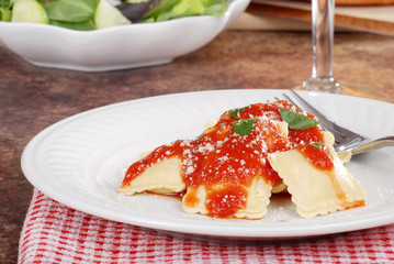 Closeup ravioli with cheese and basil