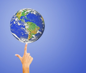 Hand with planet earth.Elements of this image furnished by NASA