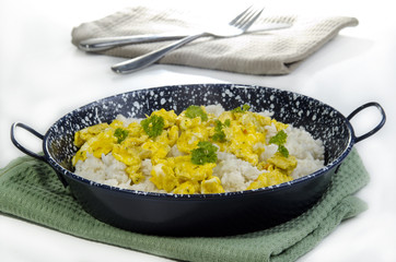 Long-grain rice with scrambled eggs in a pan