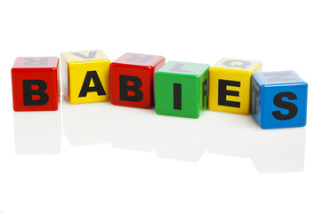 BABIES spelled with alphabet building blocks