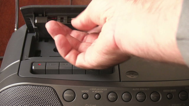 hand inserting cassette