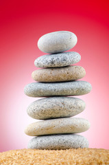 Balanced pebbles with colour background