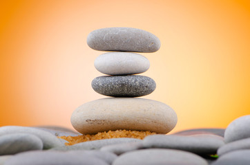 Balanced pebbles with colour background