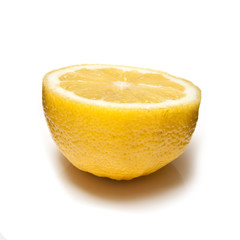 Lemon halved isolated on a white studio background.