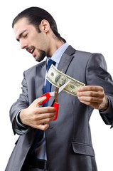 Man cutting money on white