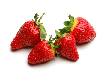 Several isolated strawberries on white background