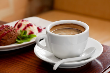 coffee cup and ice cream on restaurant table