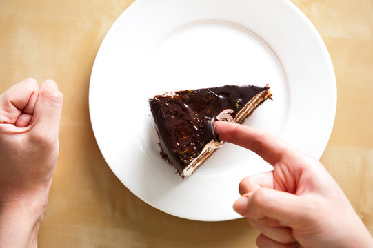 Delicious french chocolate cake on white plate on table