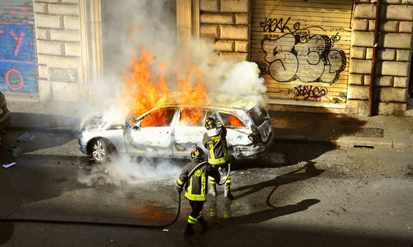 Riots - Fire fighters respond to a car fire