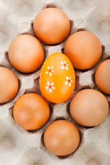 Easter background. Eggs in cardboard container