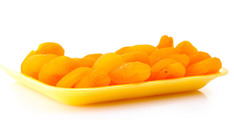 delicious dried apricots in packaging isolated on white