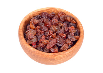 Raisin in wooden bowl, isolated on white background