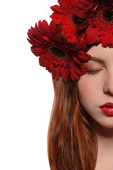 Naklejka premium half of face girl with flowers in her hair