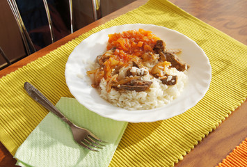Rice with meat and stewed vegetables