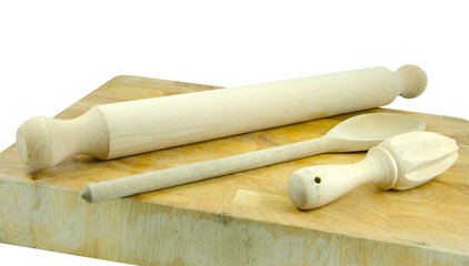 rolling pin and spoon on chopping board