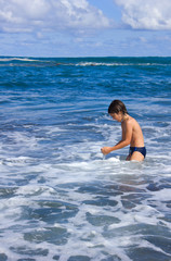 boy enjoying the sea in sunny day