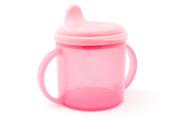 Pink baby cup over white