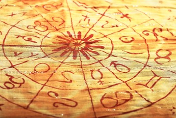 Horoscope circle on an orange cloth
