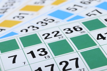Green, blue, yellow bingo cards with focus on number thirteen - 39405604