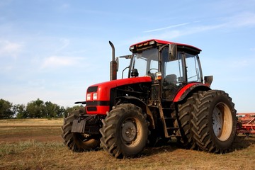Color photo of a red tractor