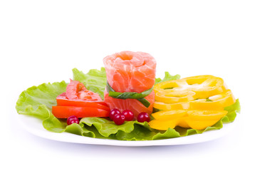 Tasty salmon rolls with mushroom, lemon and salad on the plate