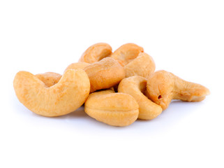Pile of roasted cashew nuts in isolated white background