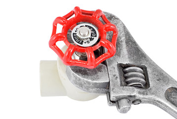 Wrench and tap, isolated on white background