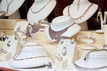 counter with  jewelry in store window