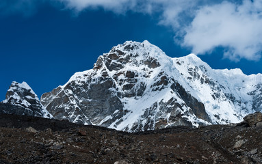 Snowed up mountain peaks and clouds in Himalayas