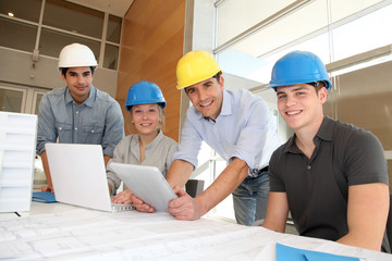 Students in architecture working on electronic tablet