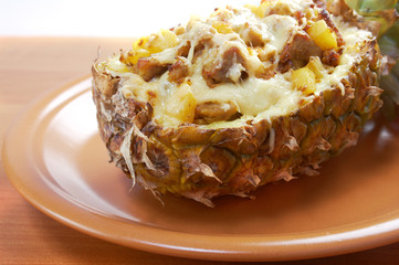 roast meat with cheese  grilled  in pineapple