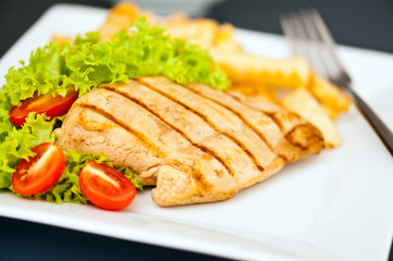 Chicken, French fries and salad