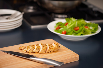Sliced chicken breast as salad ingredient