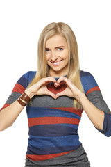 Young female forming heart shape with her hands