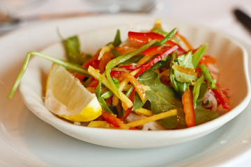 Salad of Mixed Greens and Peppers with Lemon Wedge