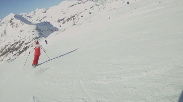 Athlete skiing down a mountain.