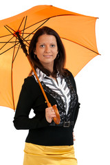 Portrait of happy young female with a orange umbrella isolated o