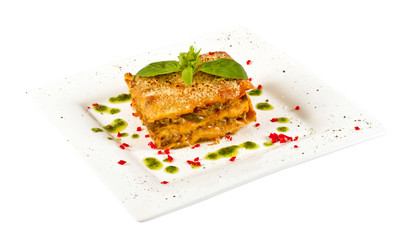 Closeup of lasagna and basil fork