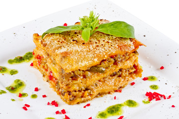 Closeup of lasagna and basil fork