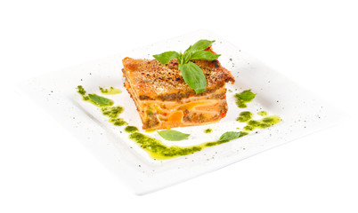 Closeup of lasagna and basil fork