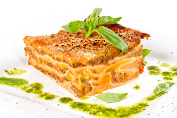 Closeup of lasagna and basil fork