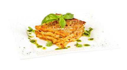 Closeup of lasagna and basil fork
