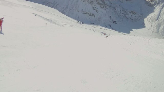 Athlete skiing down a mountain.