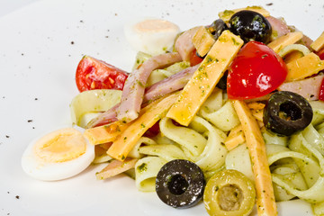 photo of delicious pasta (tagliatele) with bacon and tomatoes